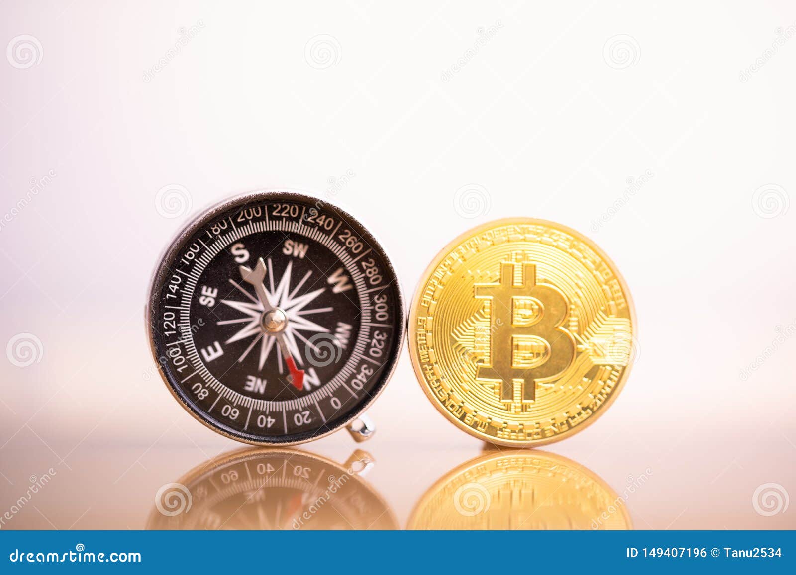 Bitcoin coin and compass. stock photo. Image of bitcoin - 149407196