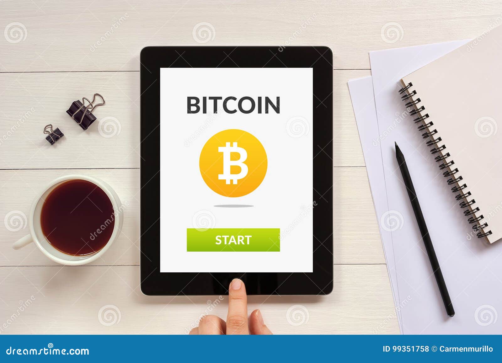 bitcoin concept on tablet screen with office objects