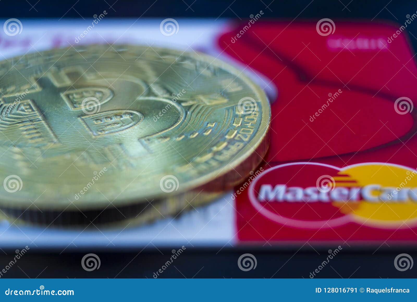Bitcoin and Mastercard editorial photo. Image of ...