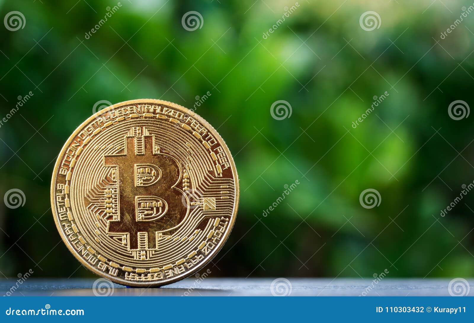 bitcoin on wooden table and nature background.bitcoin as most important cryptocurrenc