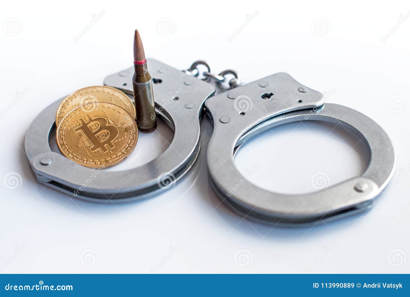 bitcoins, bullets and handcuffs as an abstract  of crime t