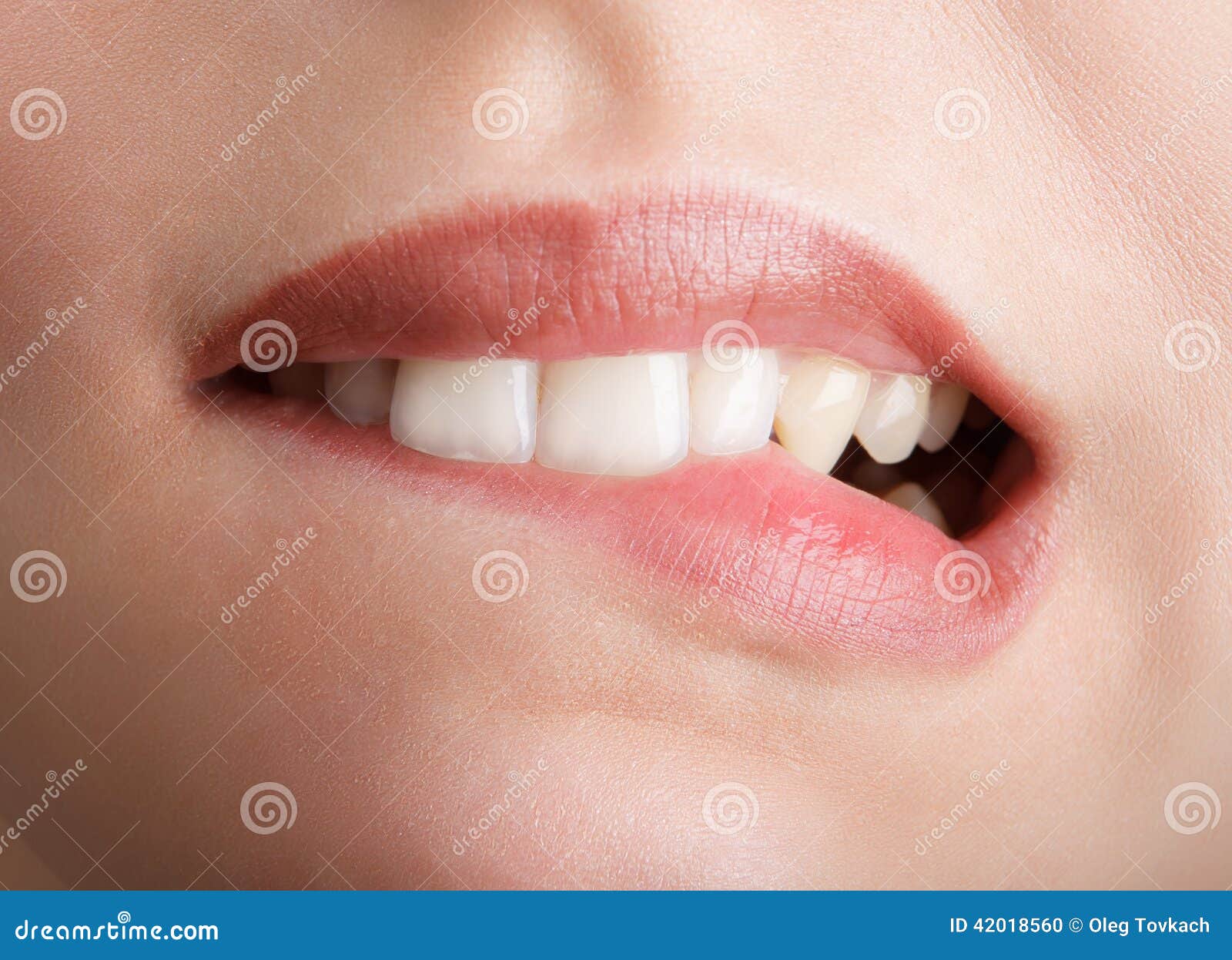 Biting her red lips teeth stock photo. Image of mouth 42018560