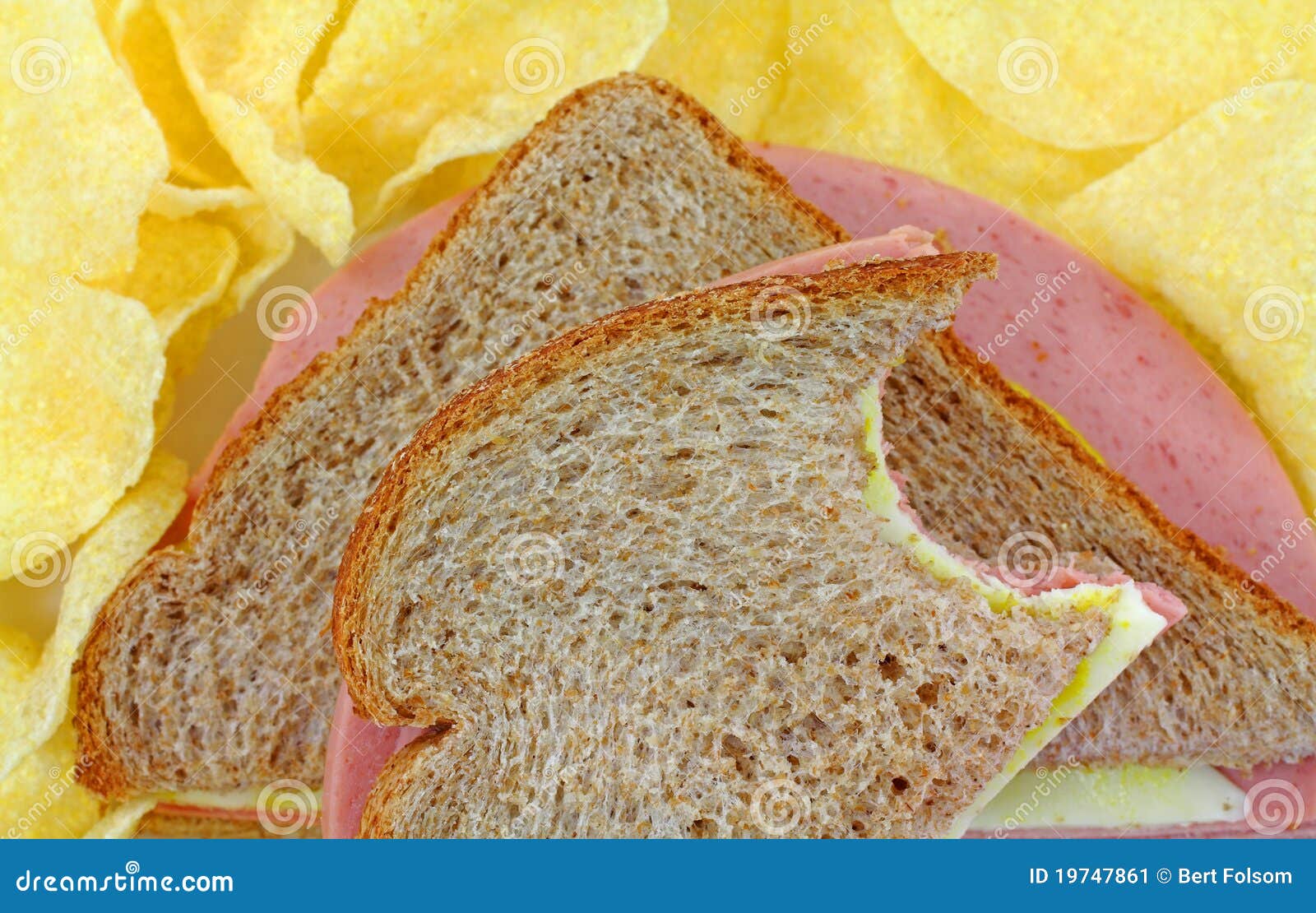 Bitten Bologna and Cheese Sandwich with Chips Stock Image Image of