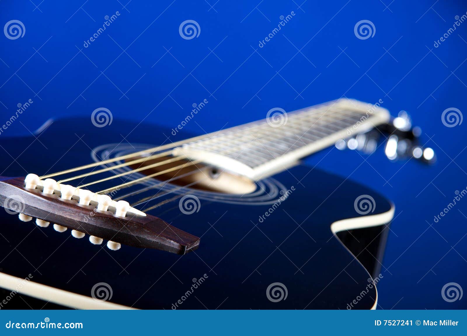 Black Acoustic Guitar on Blue Stock Image Image of space, strings