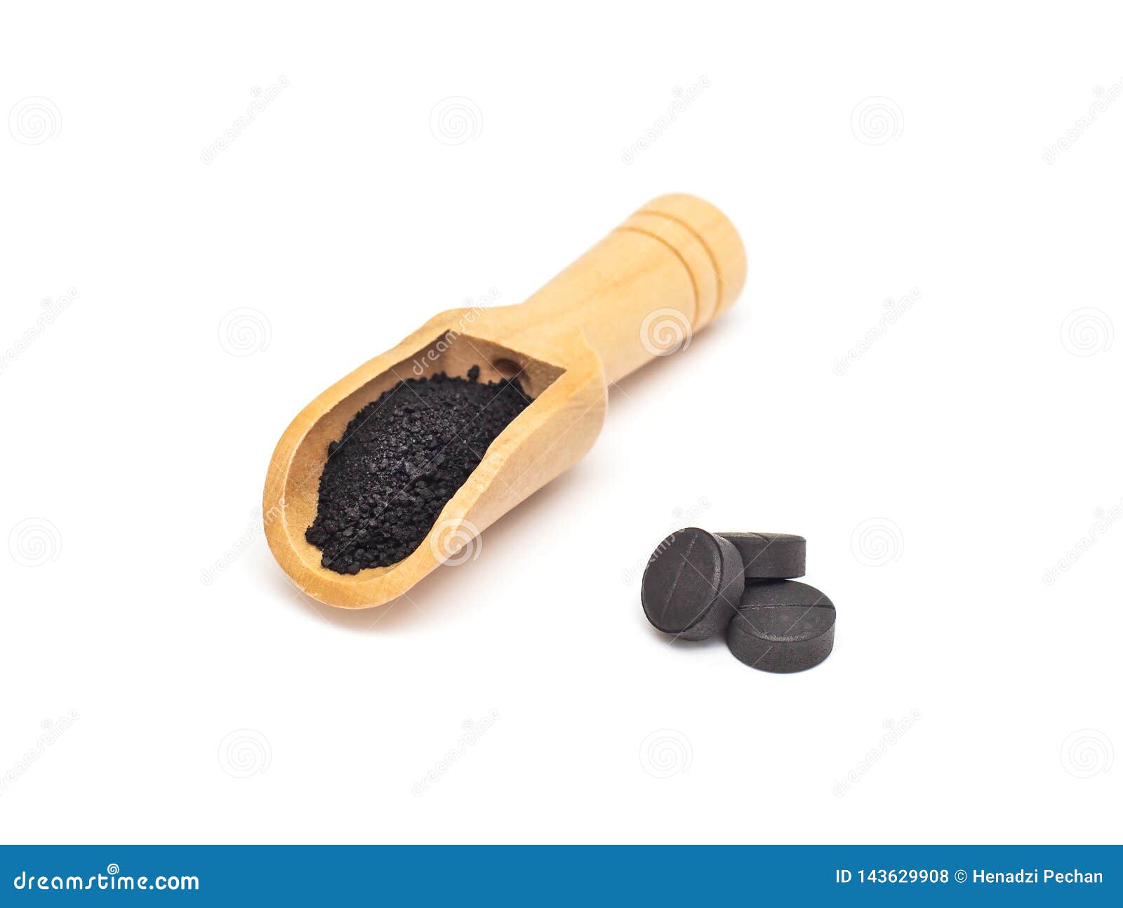 Black Activated Carbon Tablets and Powdered Carbon on a White Background Concept of Use in