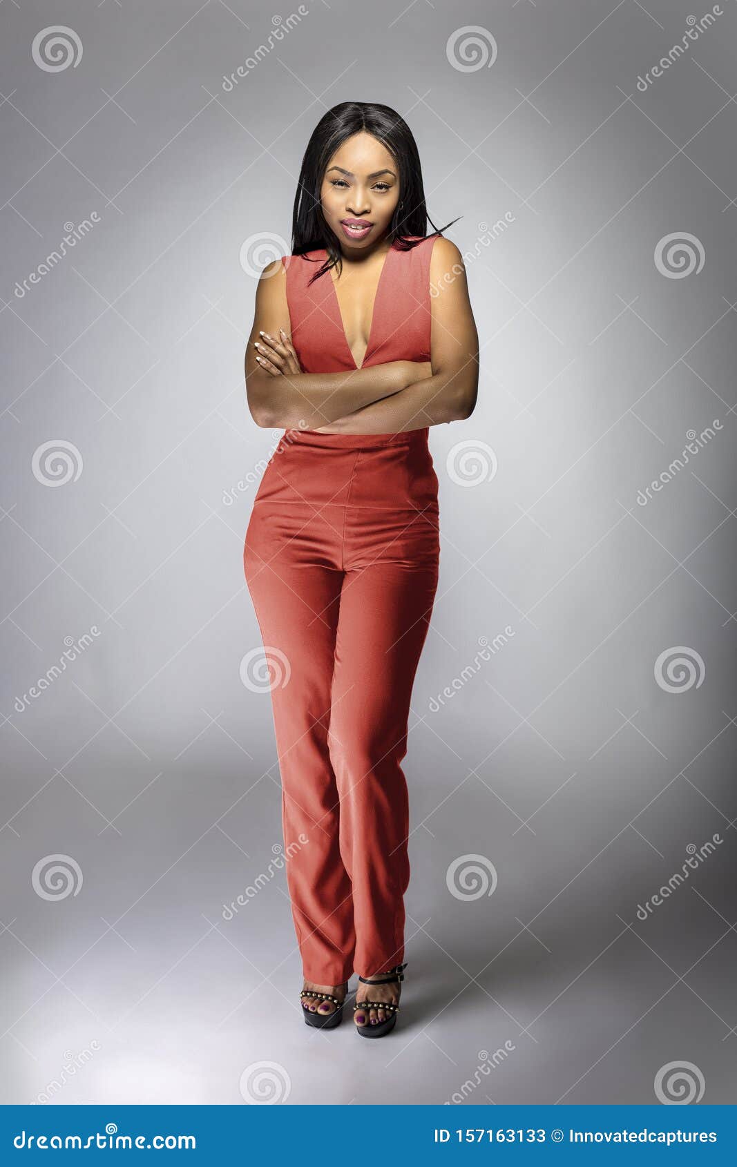 Black African American Fashion Model Wearing an Orange Jumpsuit Stock ...