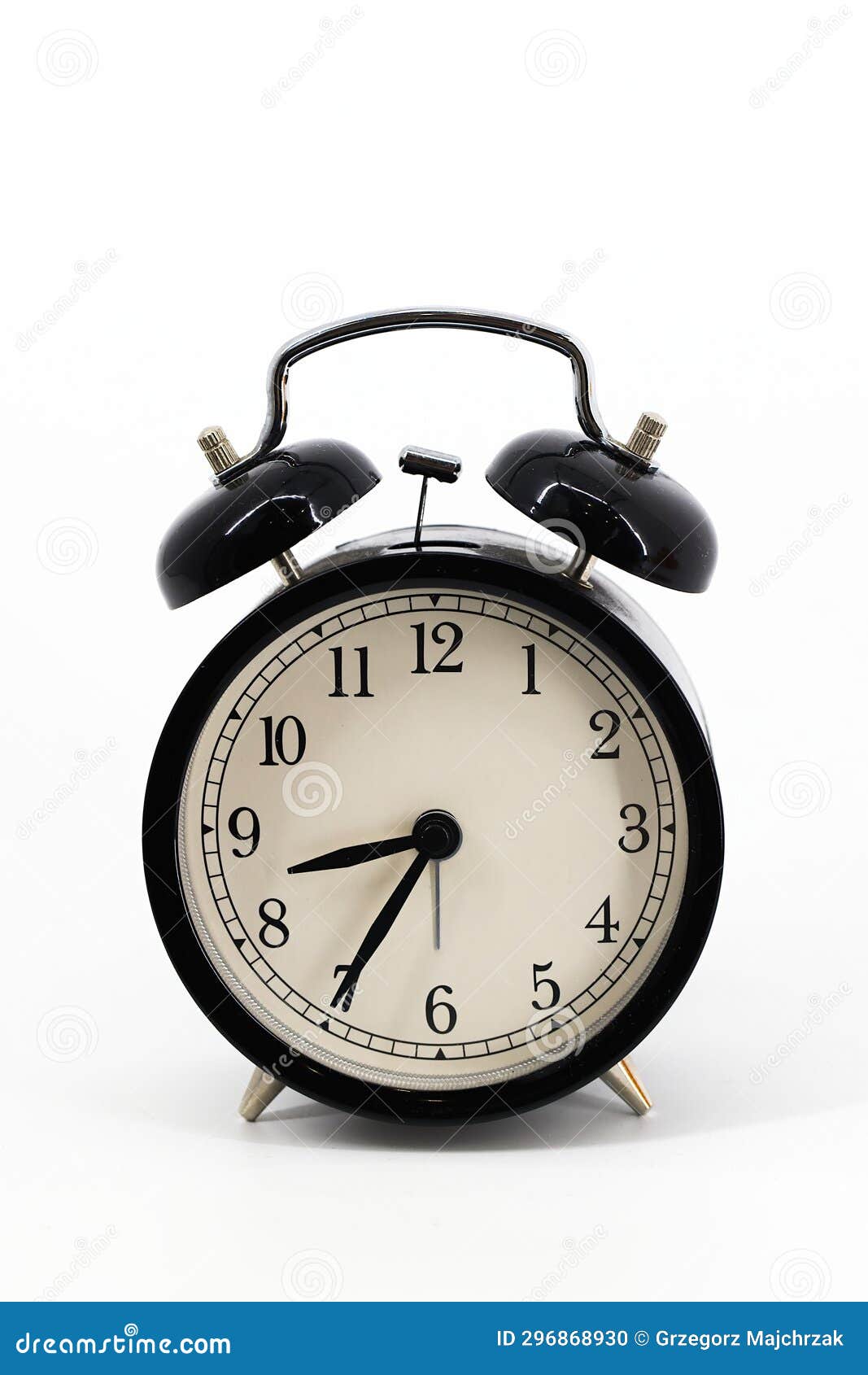 A Black Alarm Clock with Two Bells on Top, Chrome Handle, and Legs, Set