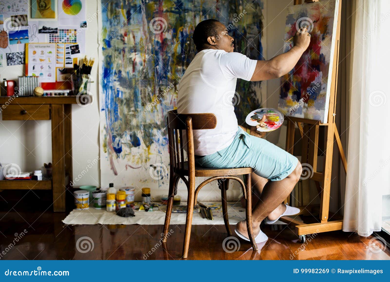 black artist man doing his art work