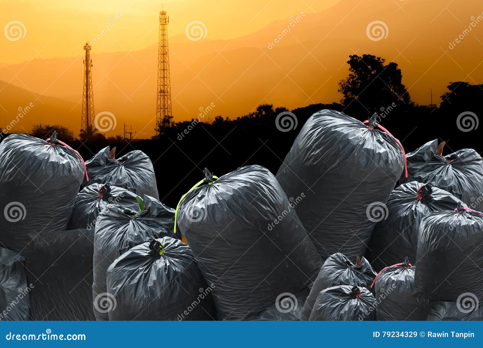 Black Bag of Rubbish Isolated on Industry Landscape Background Stock