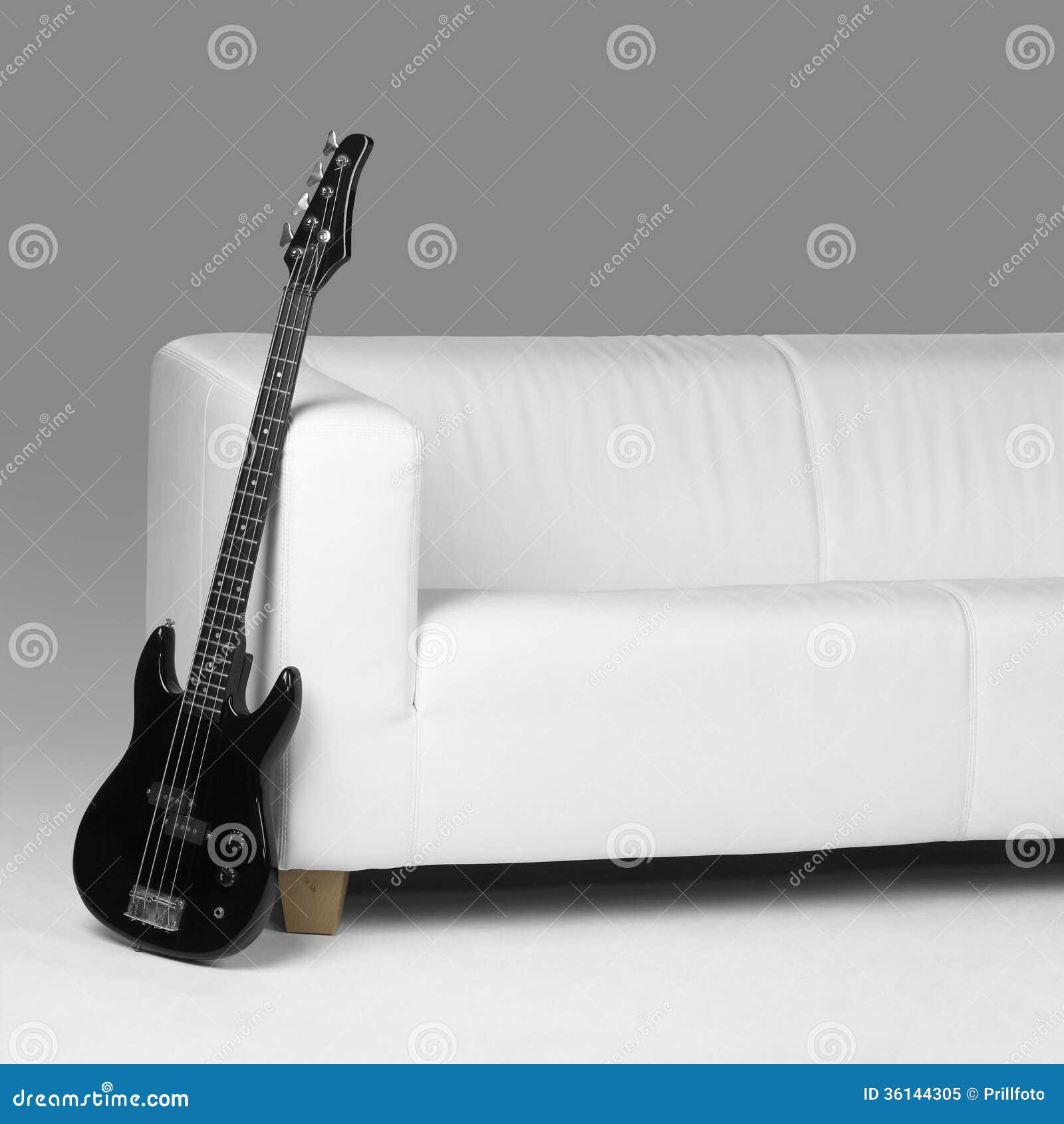 Black Bass Guitar and White Couch Stock Image Image of roll