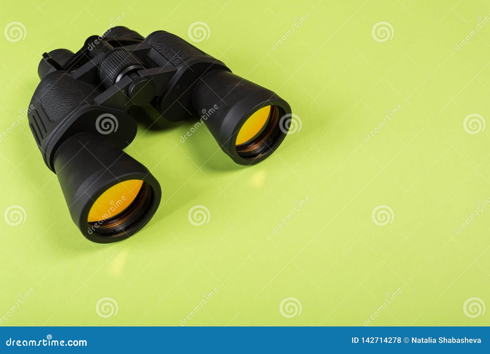 Binoculars with Orange Lens on Green Background Stock Photo Image of