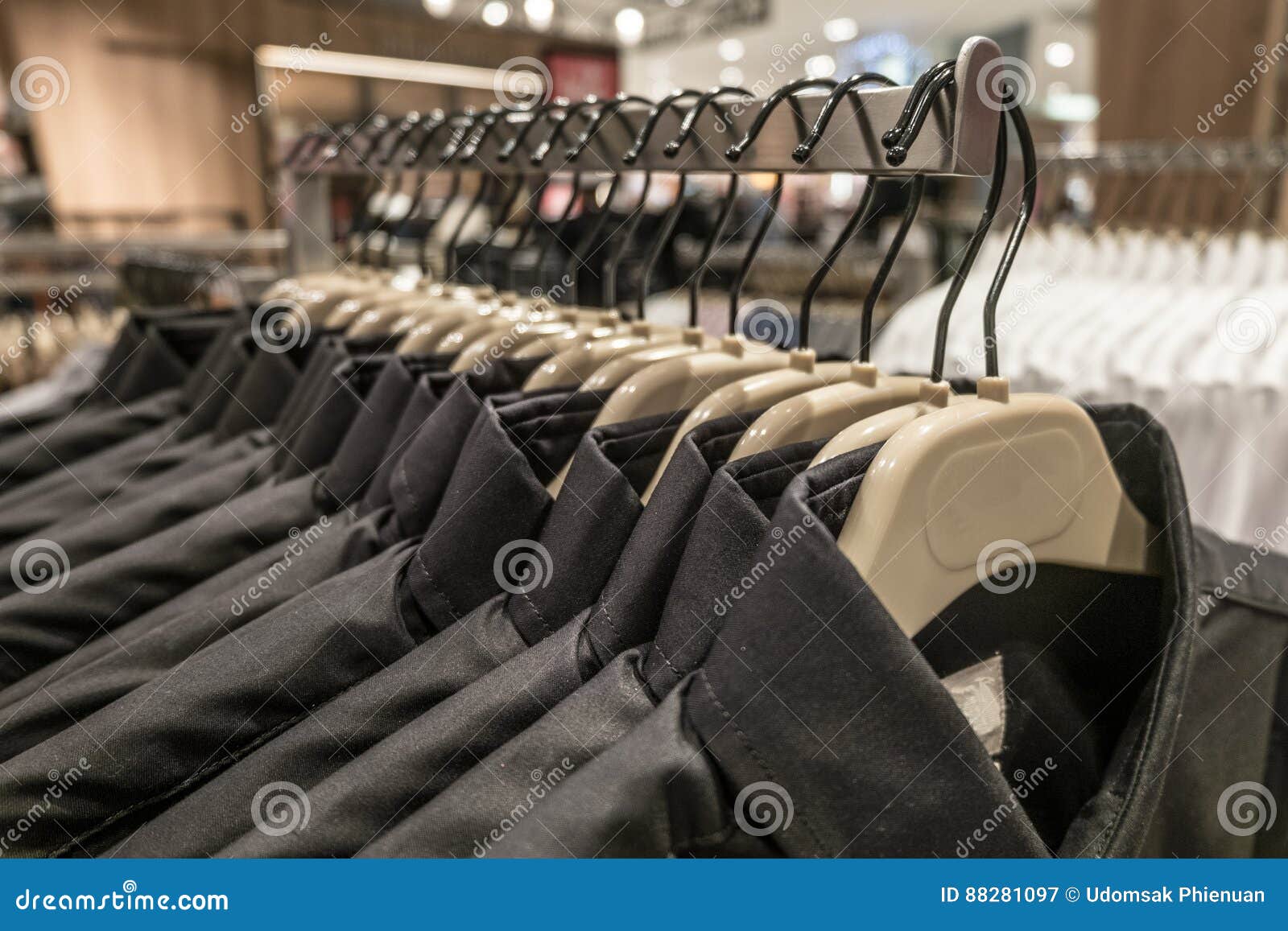 Black and Blue Shirt Hang on the Rack, Men`s Shirts on Hangers in ...