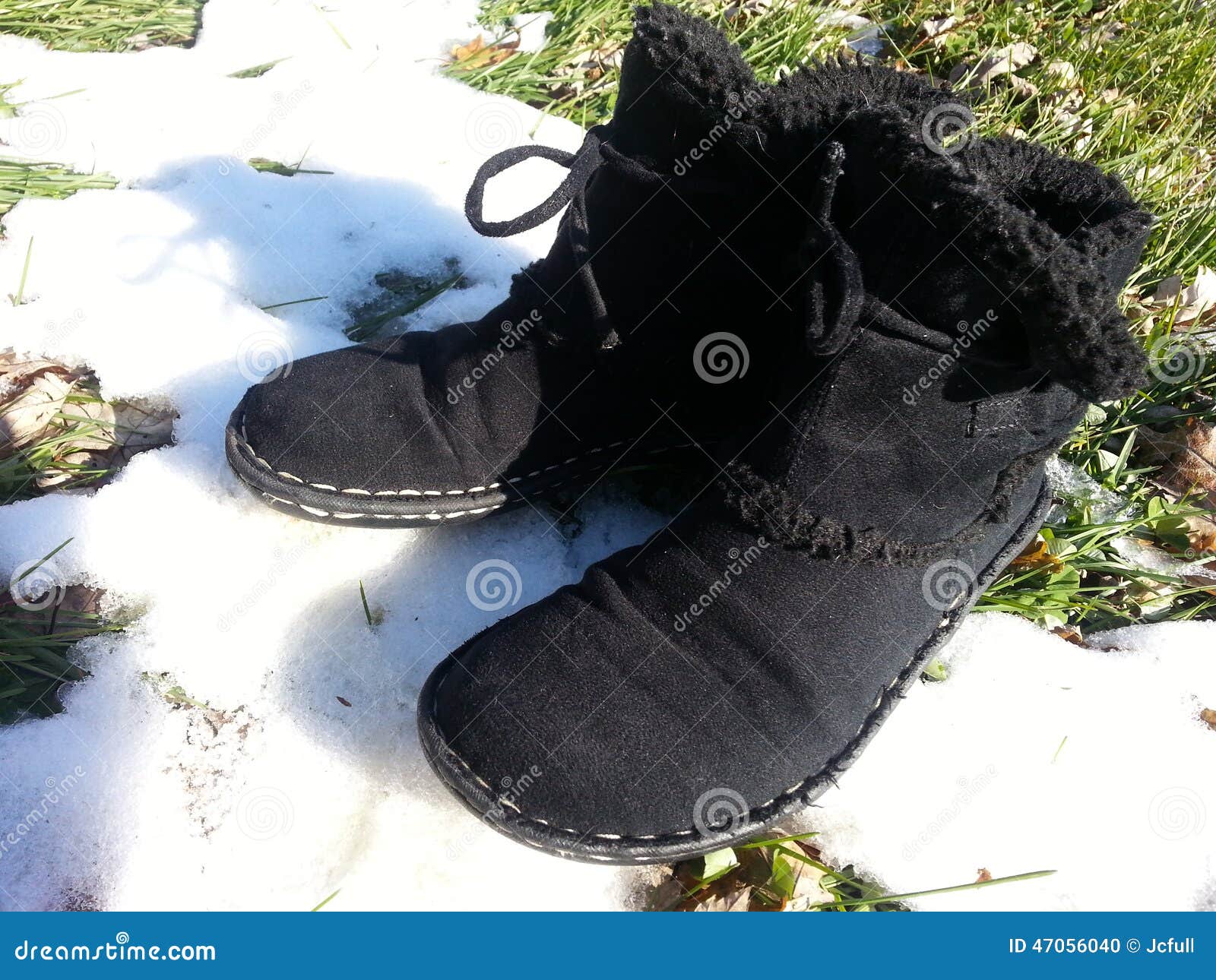Black Boots in Melting Snow Stock Photo Image of sliding, cold 47056040