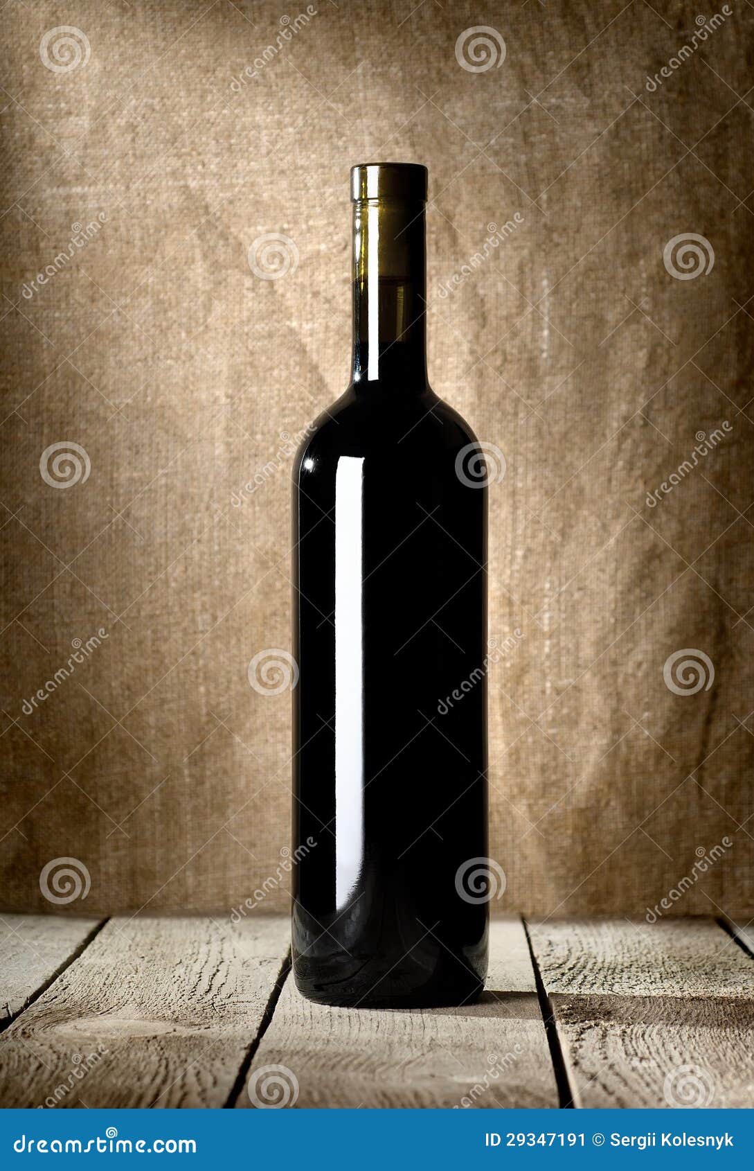 Black bottle of red wine stock image. Image of plank 29347191