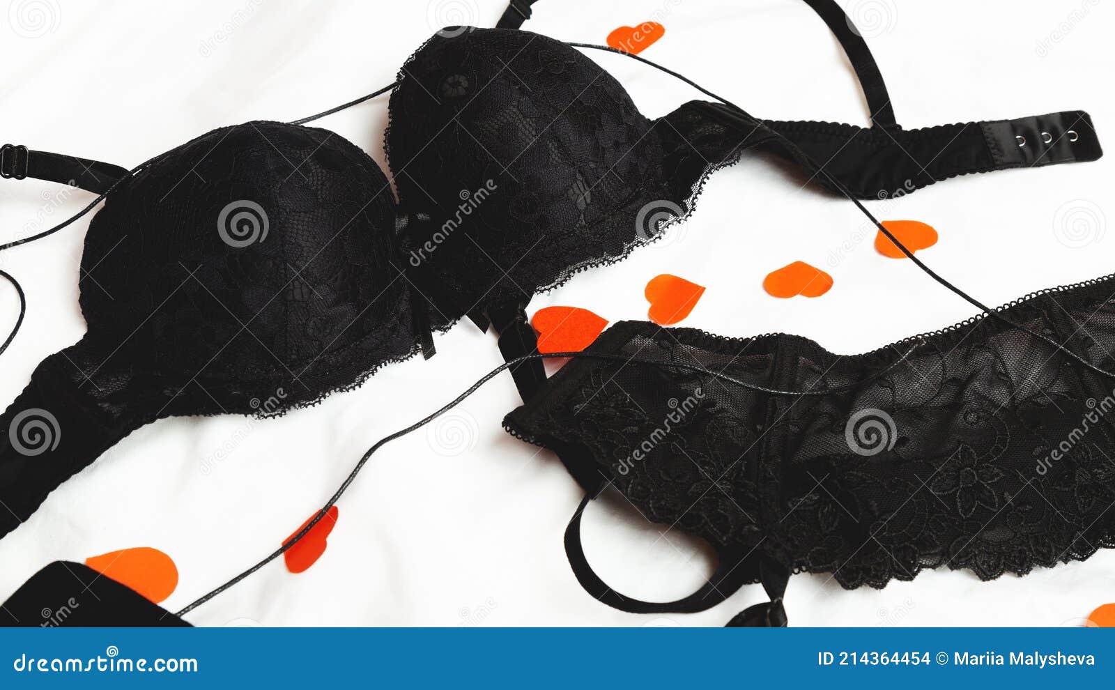 Black Bra with Suspenders. Concept of Sex. Erotic Female Underwear on a  White Bed Background with Hearts Stock Photo - Image of jewelry, design:  214364454