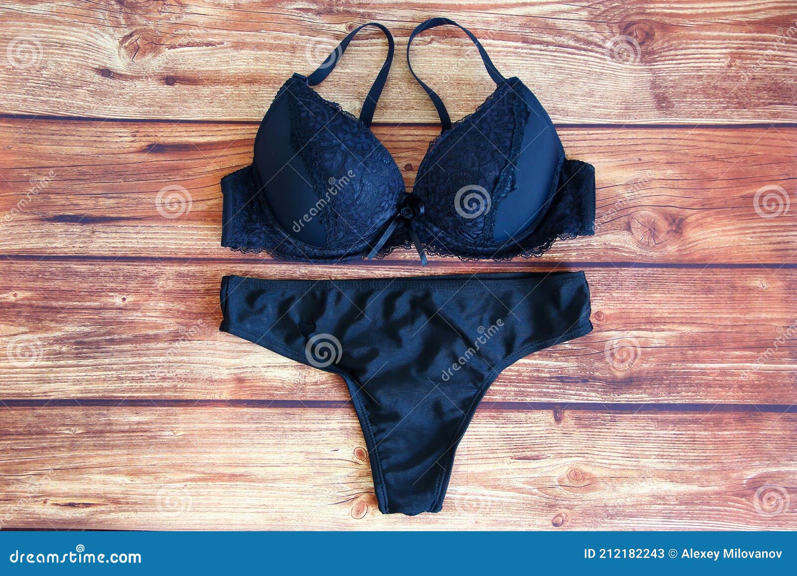 Black Bras and Panties on Wooden Background Stock Image - Image of