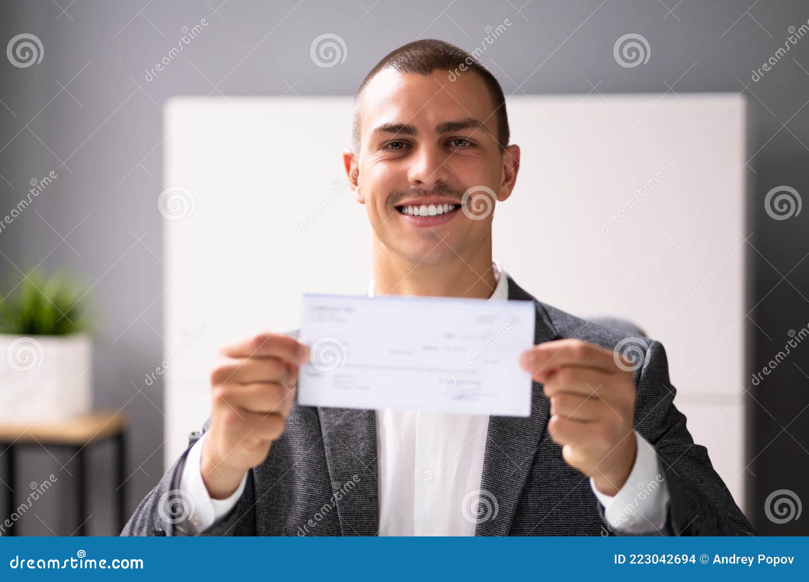 Black Business Man Holding Pay Check Stock Photo Image of