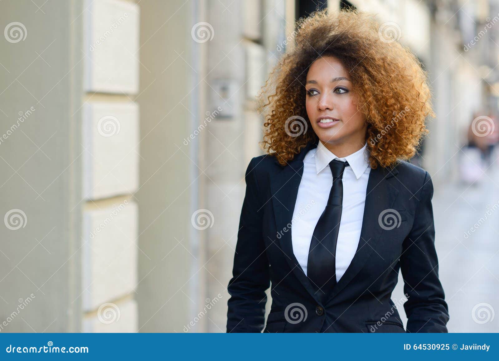 Black Businesswoman Wearing Suit and Tie in Urban Background Stock ...