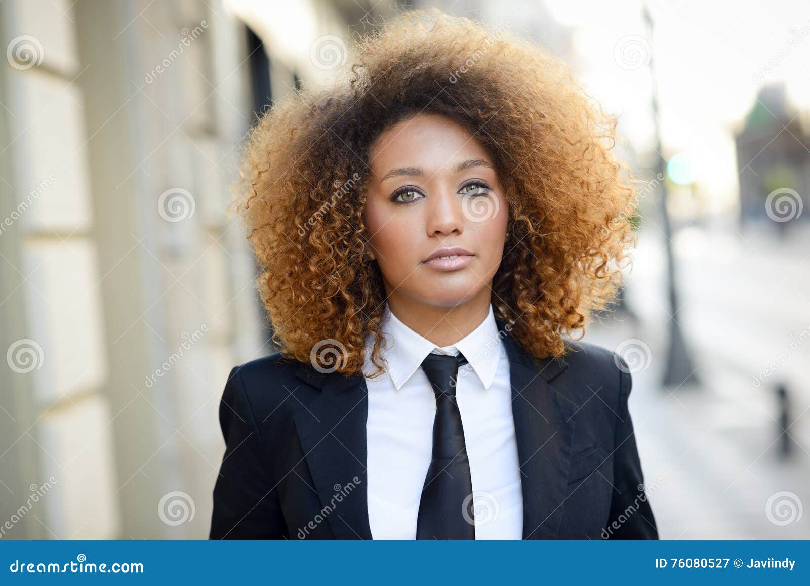 Black Businesswoman Wearing Suit and Tie in Urban Background Stock ...