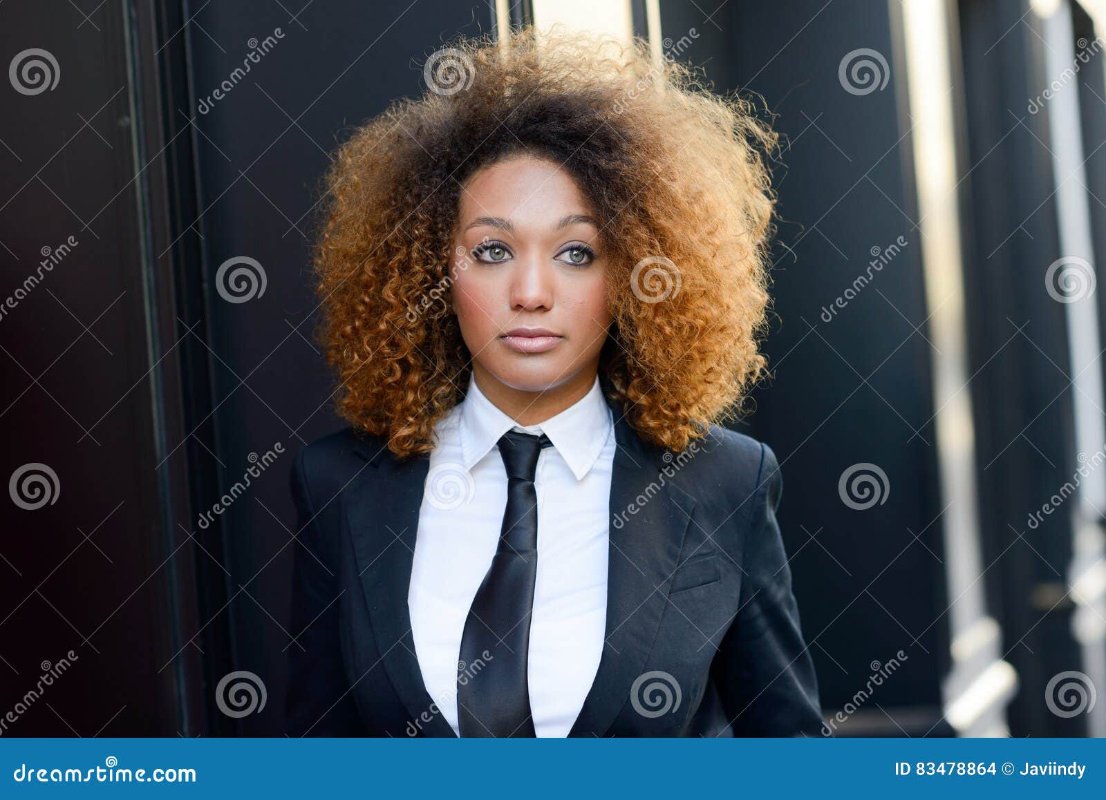 Black Businesswoman Wearing Suit and Tie in Urban Background Stock ...