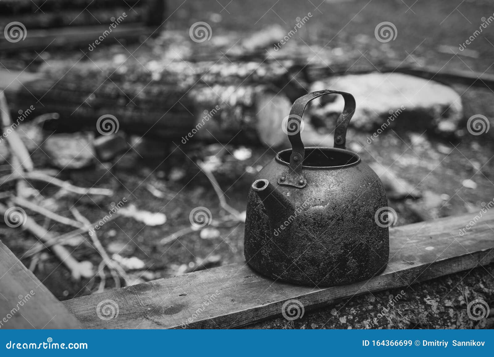 Black Camping Kettle Stands on Benches in the Forest Stock Image
