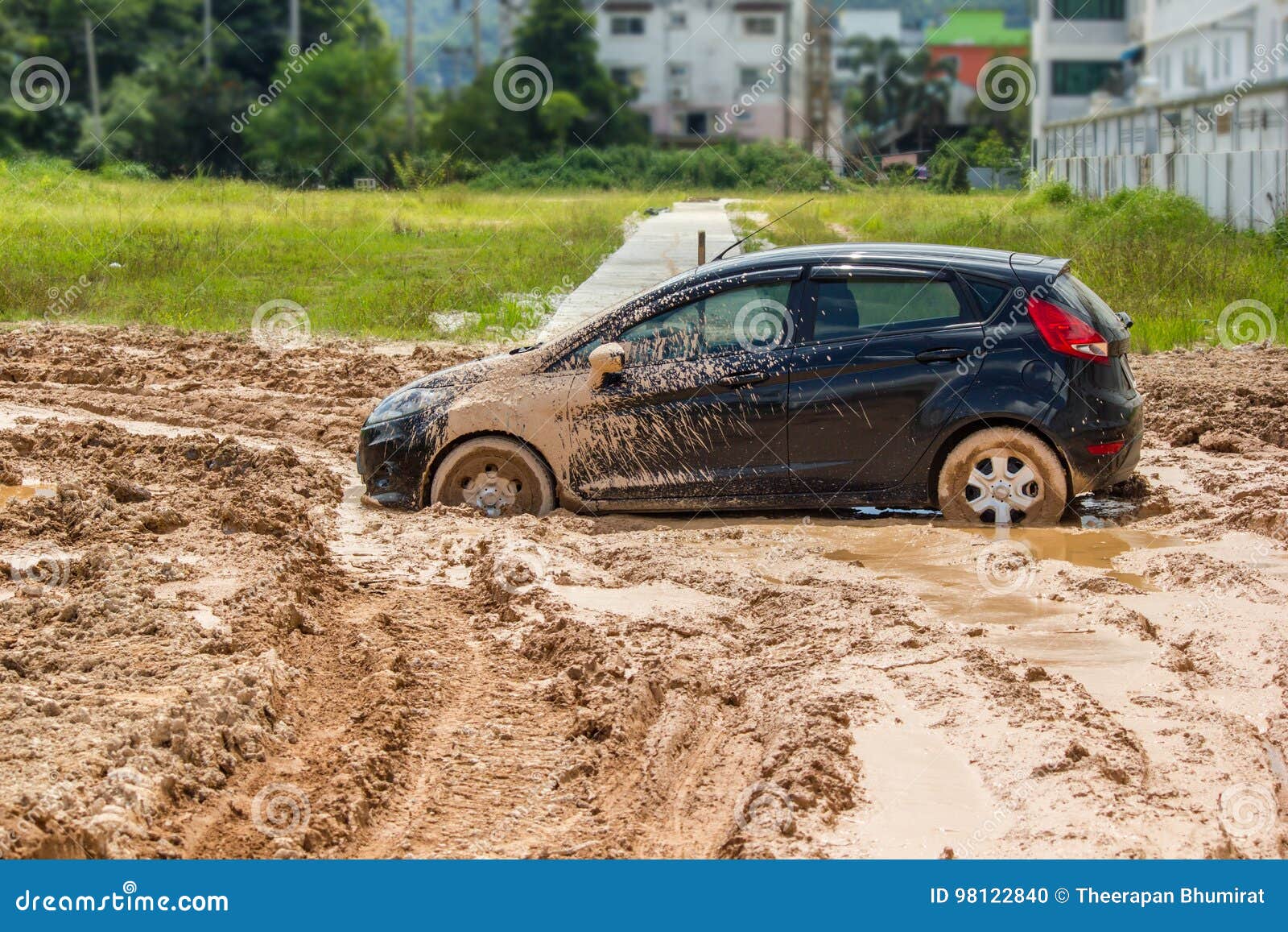 the black car stuck in the mud.