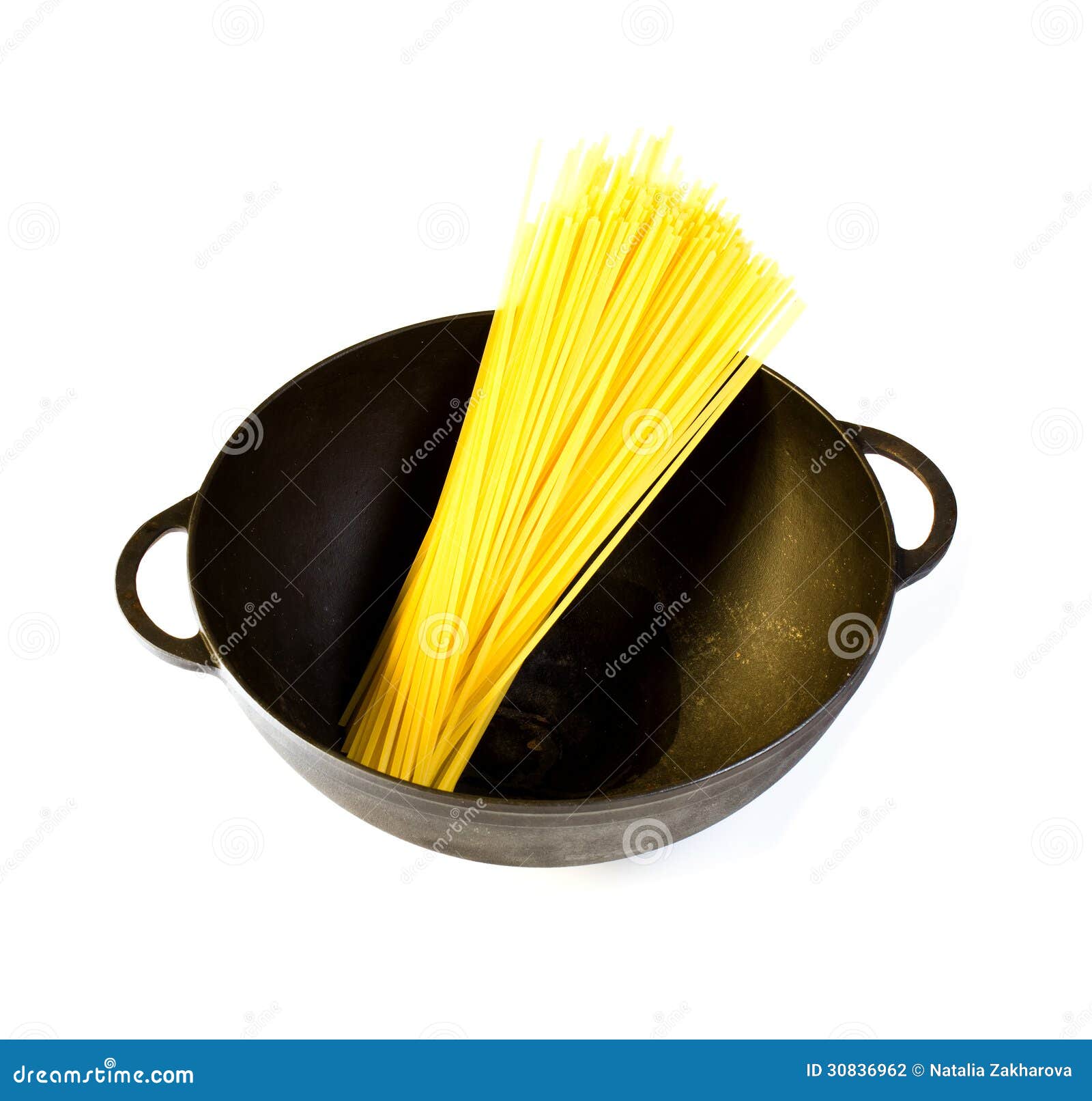Black Cast Iron Pot with Raw Pasta, Isolated Stock Photo Image of