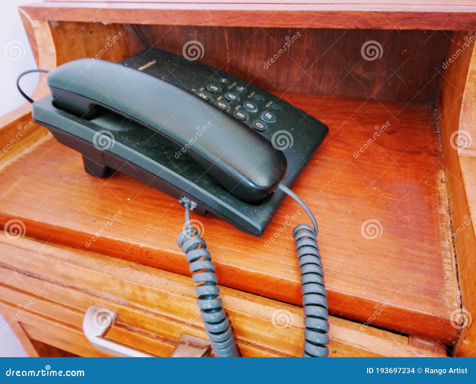 black clasic telephone on wooden desk