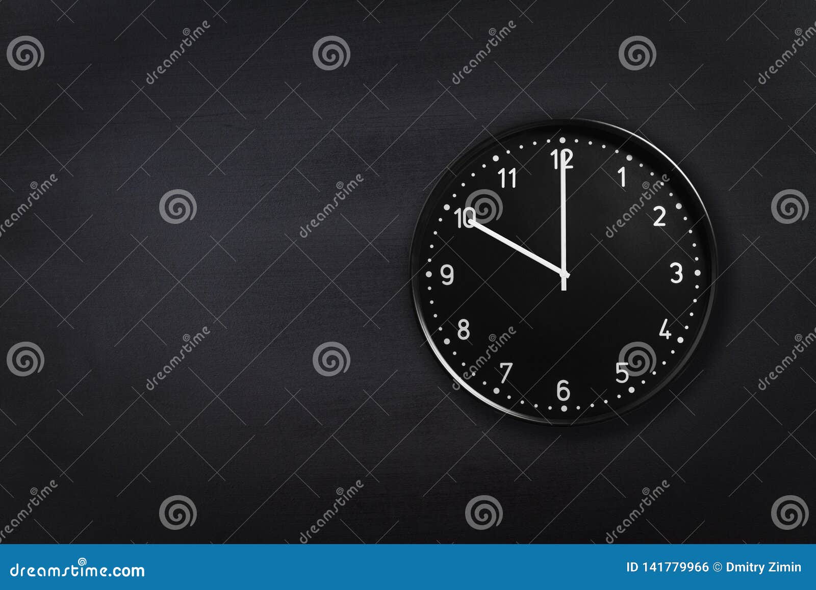 Black Clock Showing Ten O`clock On Black Chalkboard Background. Office