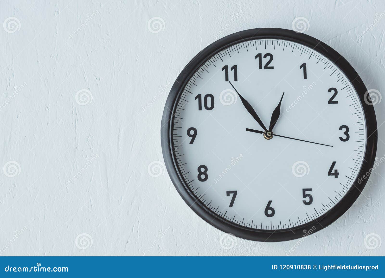 Black clock on white wall stock photo. Image of copy 120910838