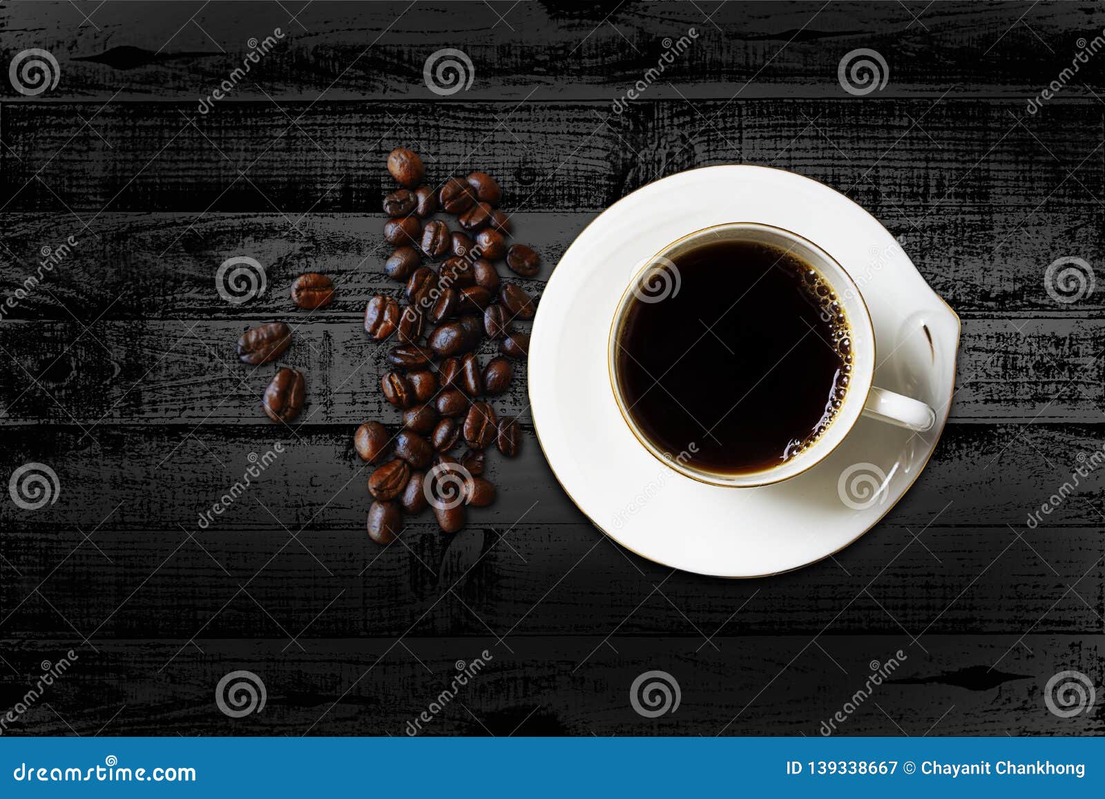 black coffee in the cup on wood dark table with copy space