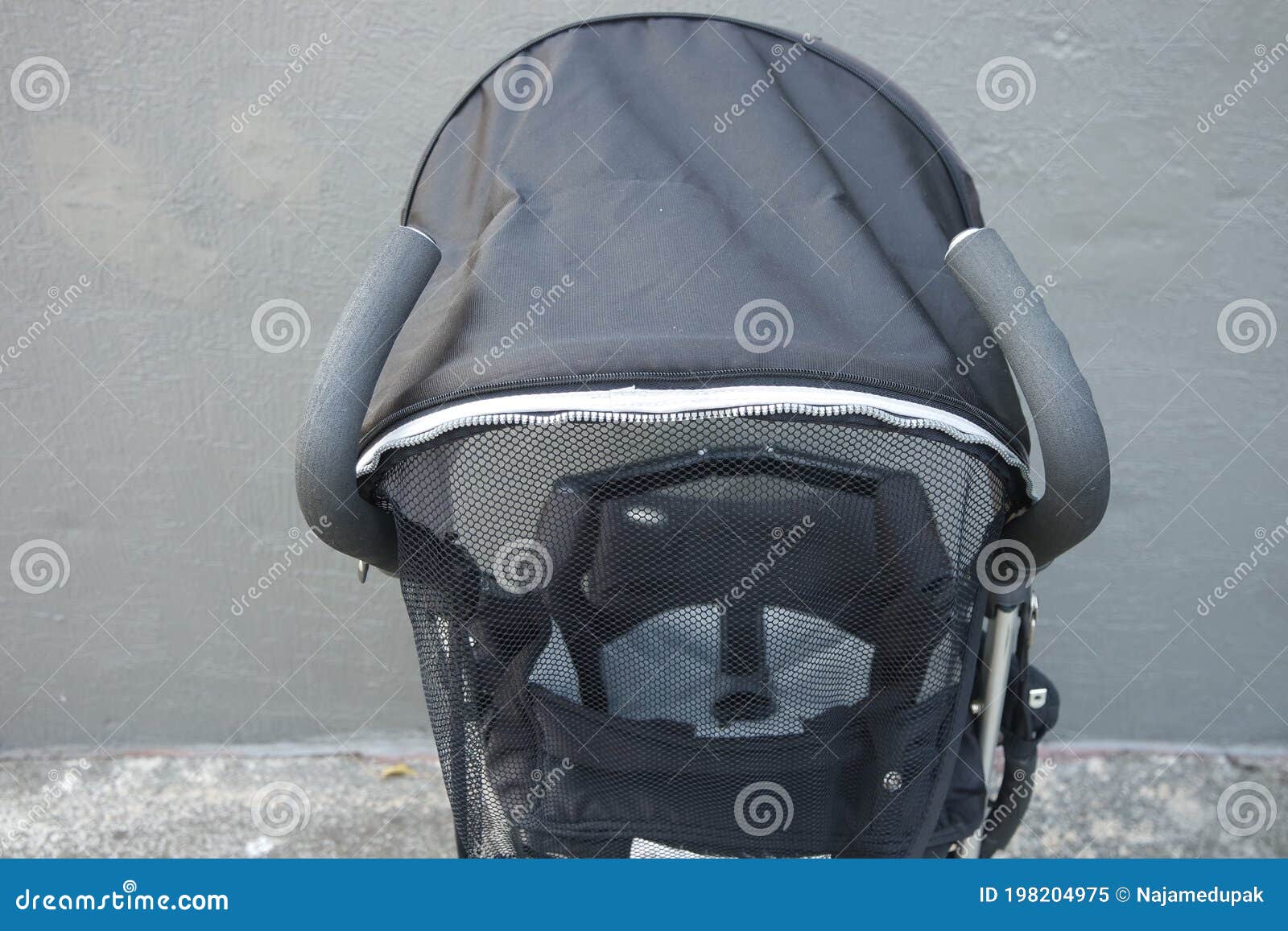 black color baby stroller with head covering