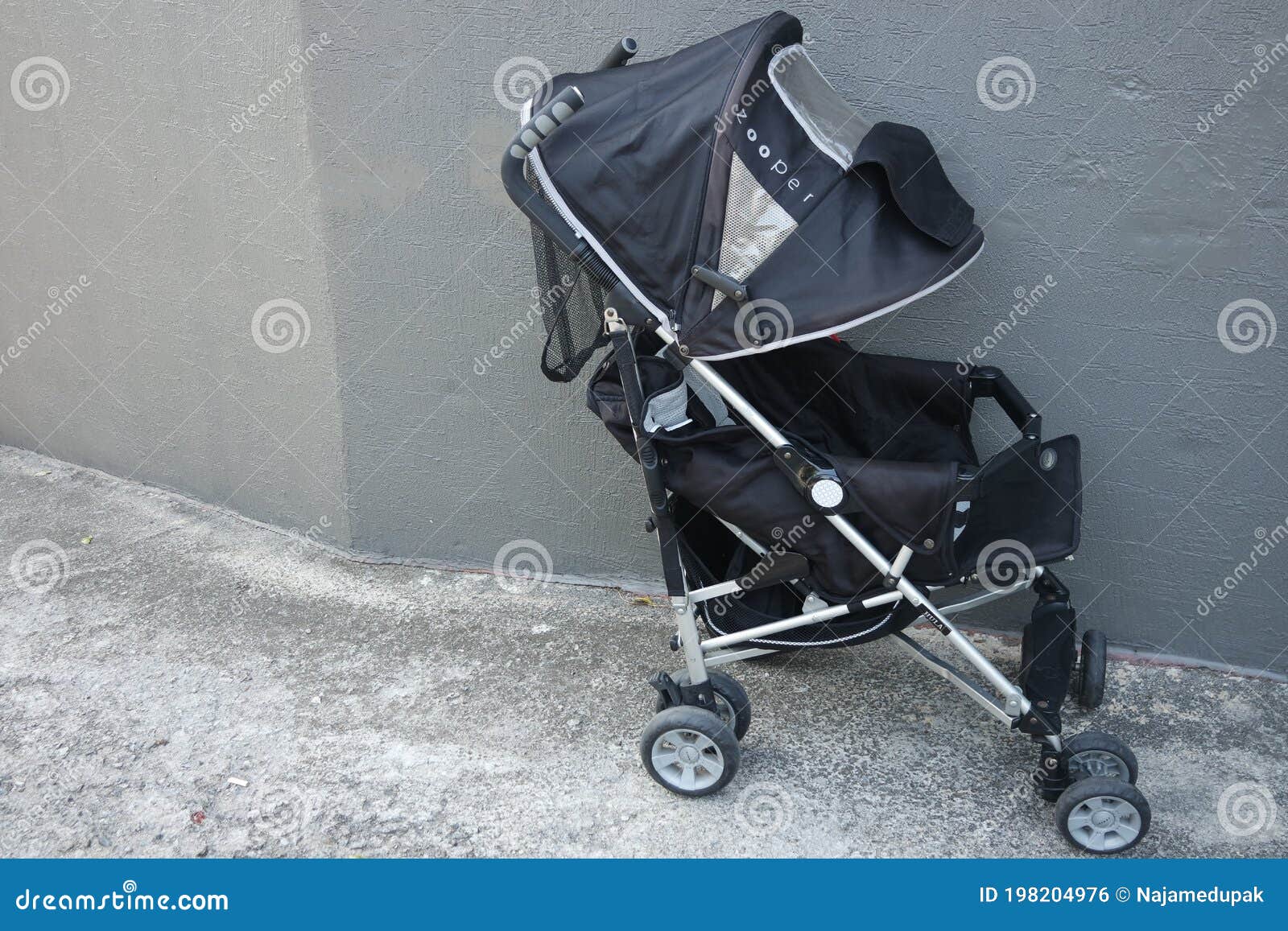 black color baby stroller with head covering