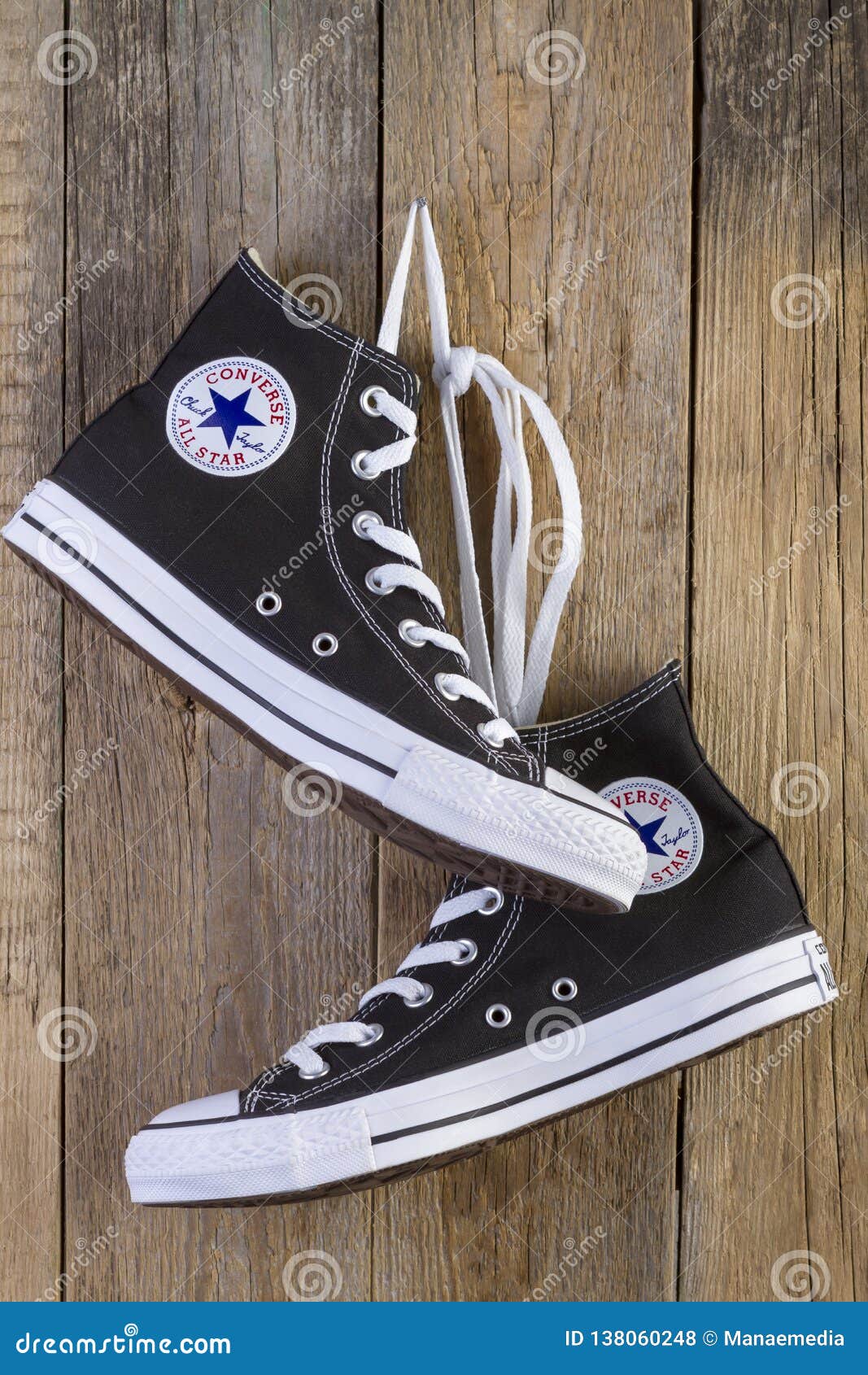 Black Converse Sneakers Shoes on Wood 