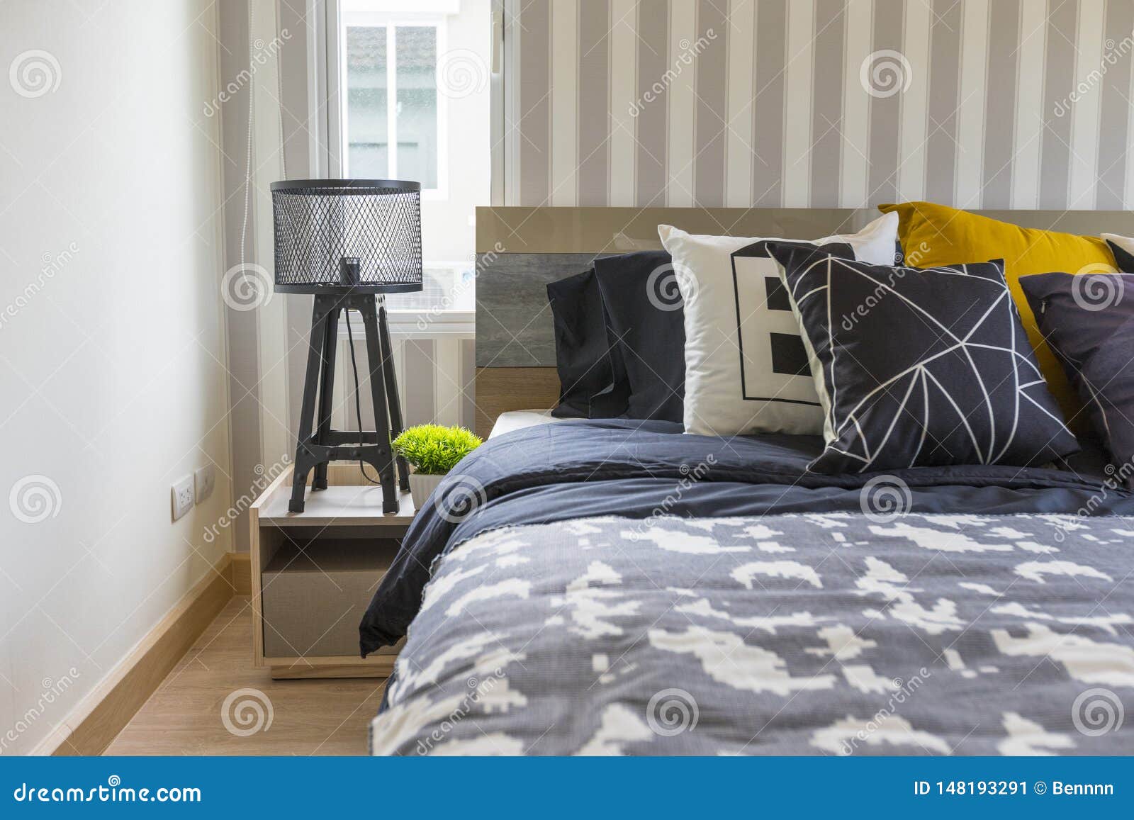 King Size Bed With Yellow Pillow In Modern Bedroom Stock Image