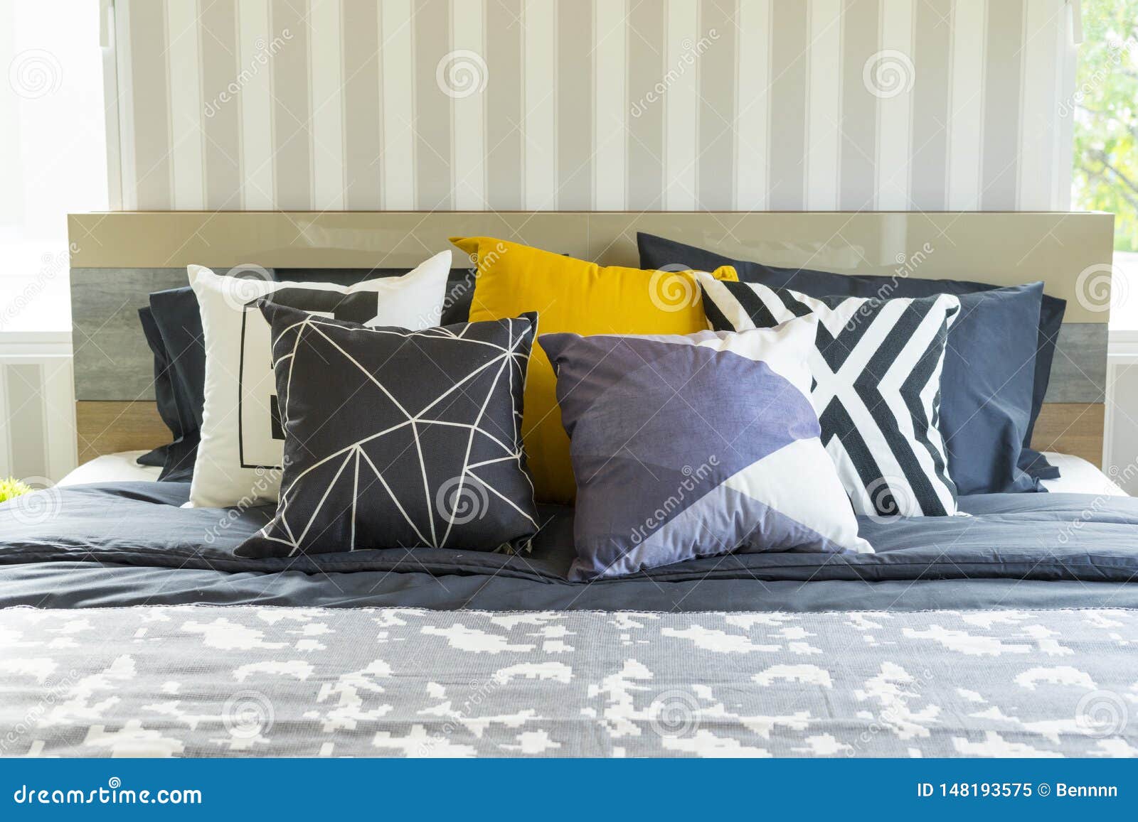 King Size Bed With Yellow Pillow In Modern Bedroom Stock Image