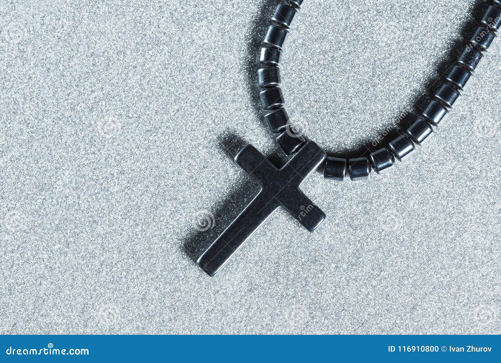 Black Cross Close-up on a Gray Background Stock Photo - Image of fabric ...