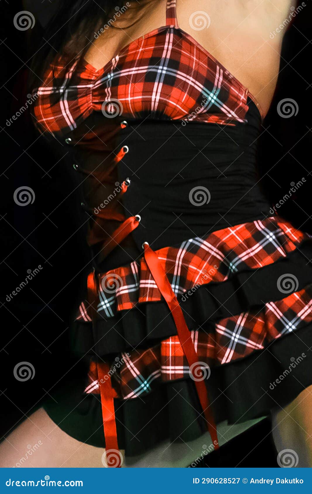 black dress on an adult woman with a pattern red check light erotica sample