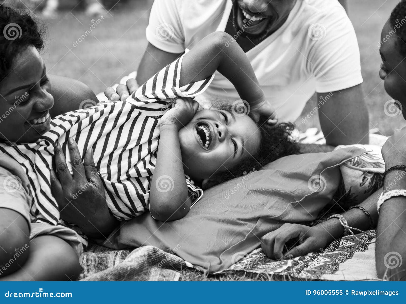 black family enjoying summer together at backyard grayscale