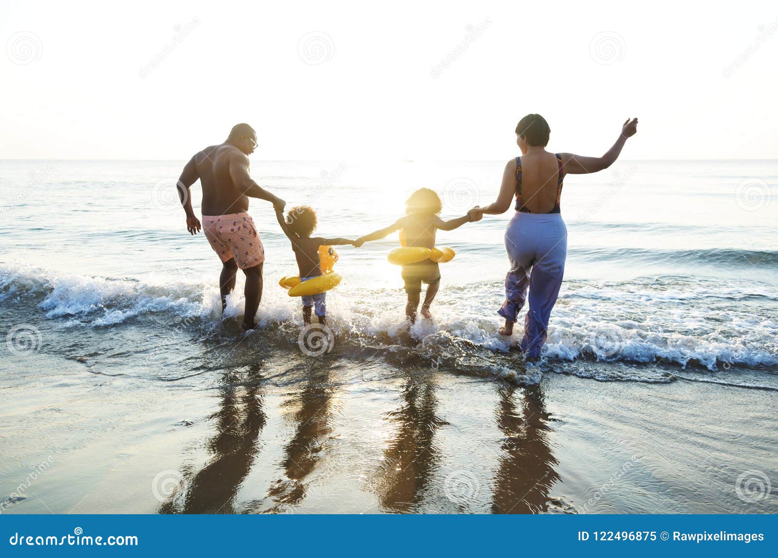 black family having fun on the beach