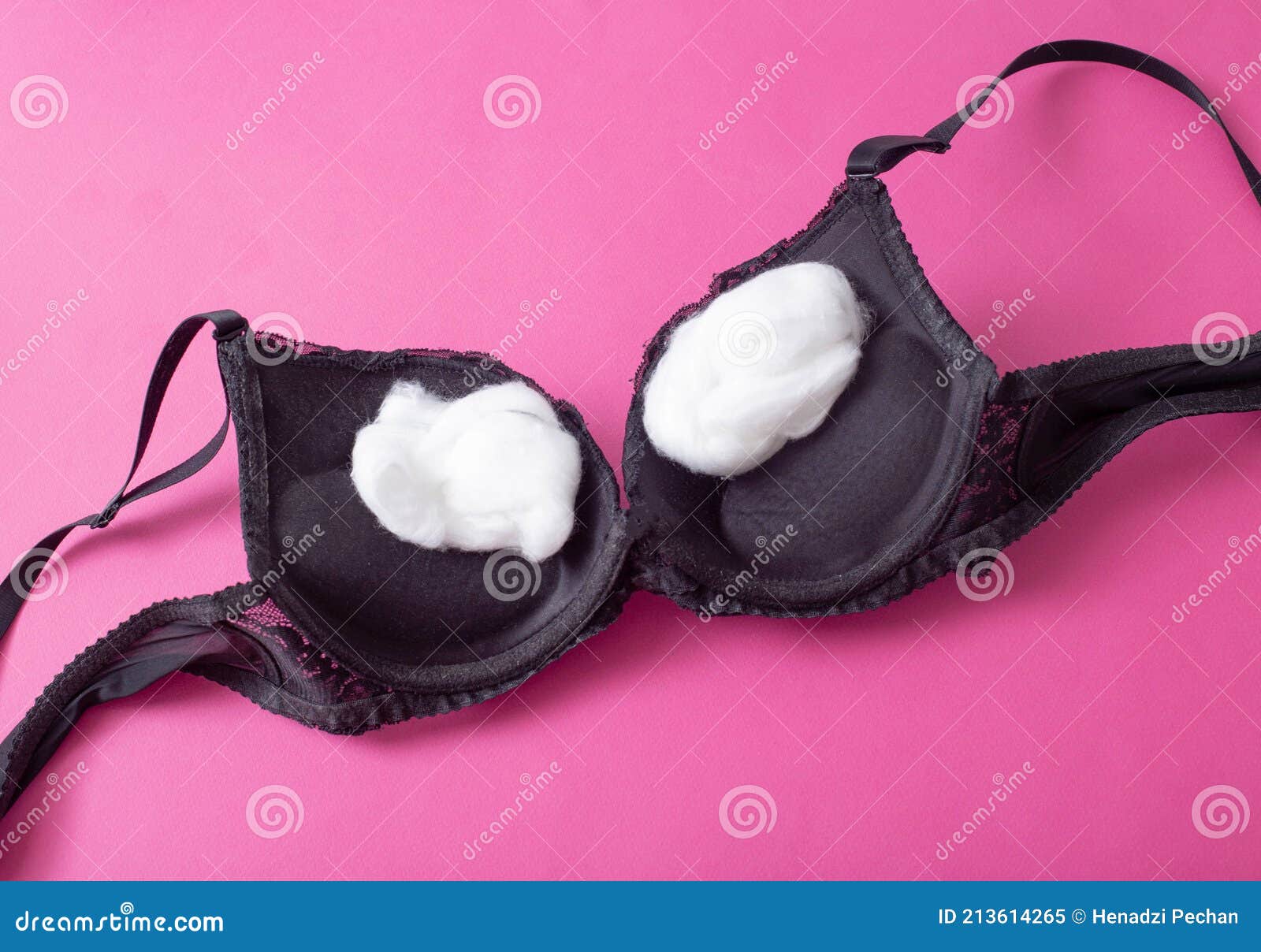 Black Female Bra with Cotton Wool Inside on a Pink Background. the Concept  of Augmentation of the Female Breast with Plastic Stock Image - Image of  pink, expertise: 213614265