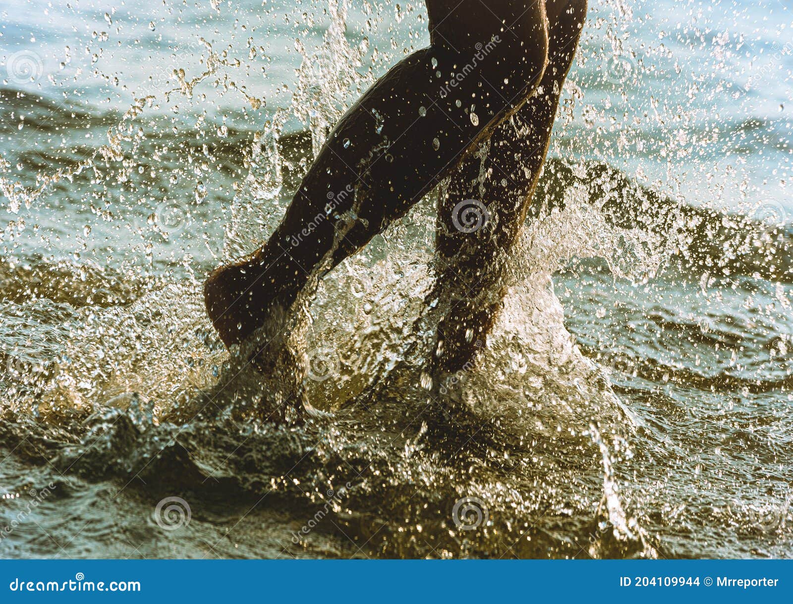 Naked girl running in water