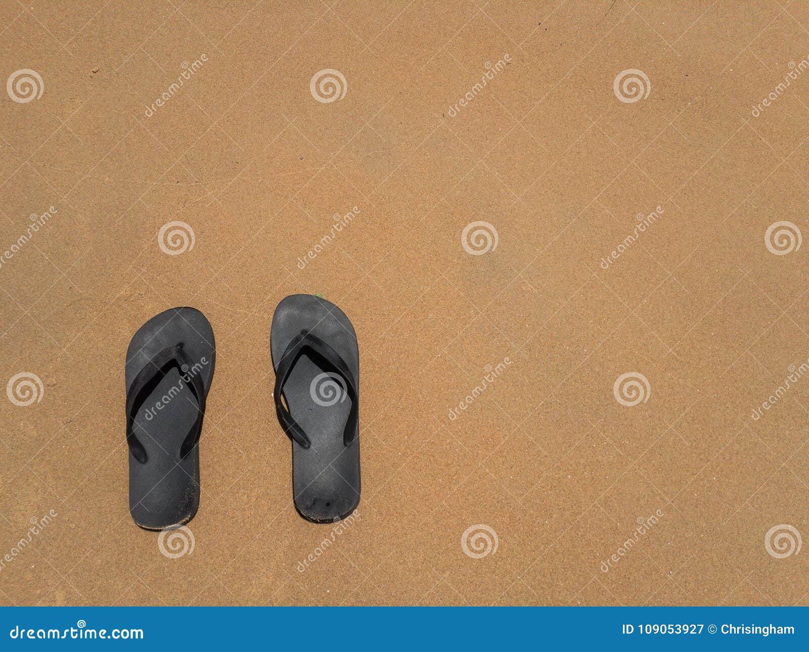Background of Flip Flops on Beach with Copy Space on the Right Stock