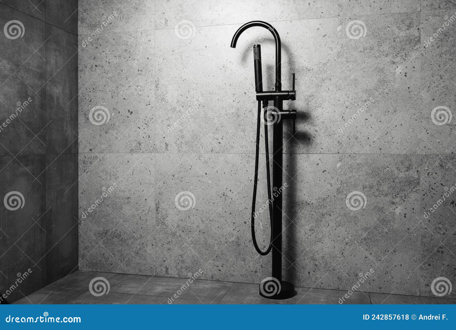 Black Floor Standing Bath Taps, on the Background of Dark Grey Bathroom