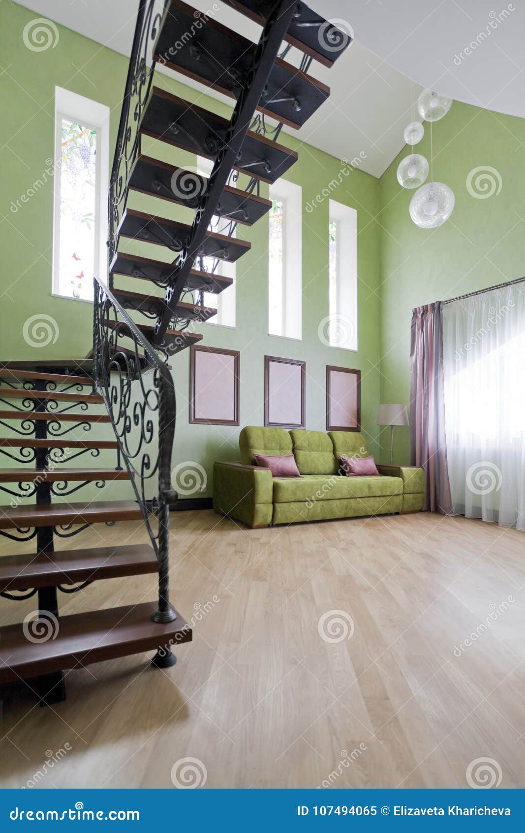 Black Forged Staircase In A High Green Interior Stock