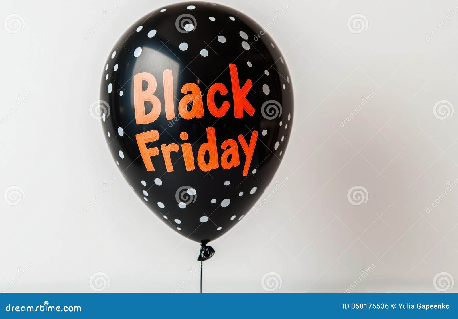 black friday balloon with polka dots in a minimal setting