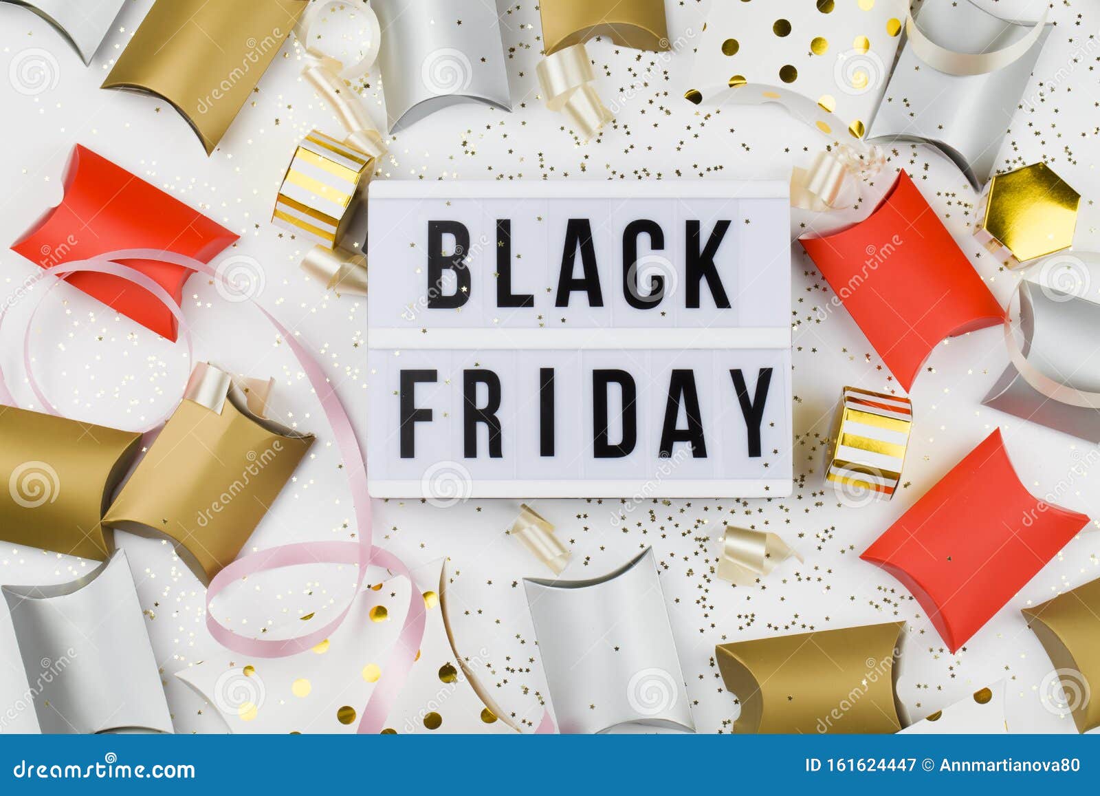 Black Friday Sale Text On White Lightbox, Golden Stars And Packaging ...