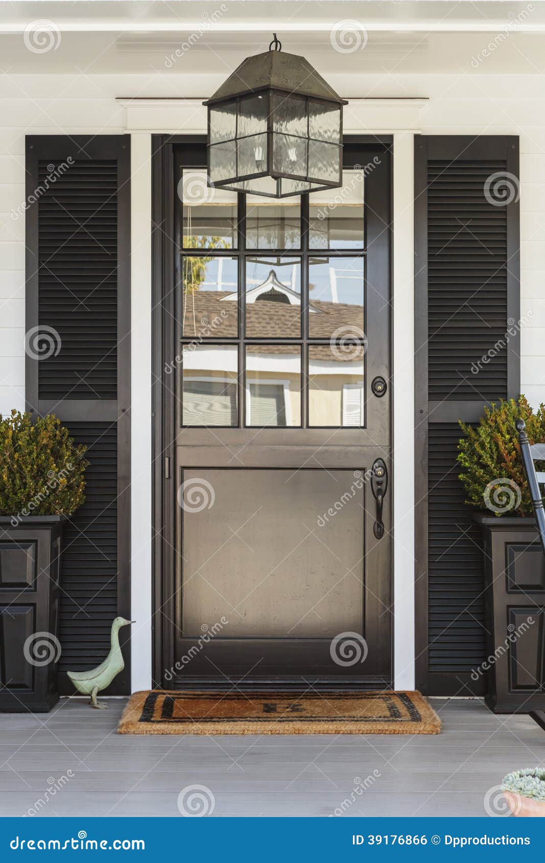 Black Front Door To a Family Home with Porch Stock Photo - Image ...