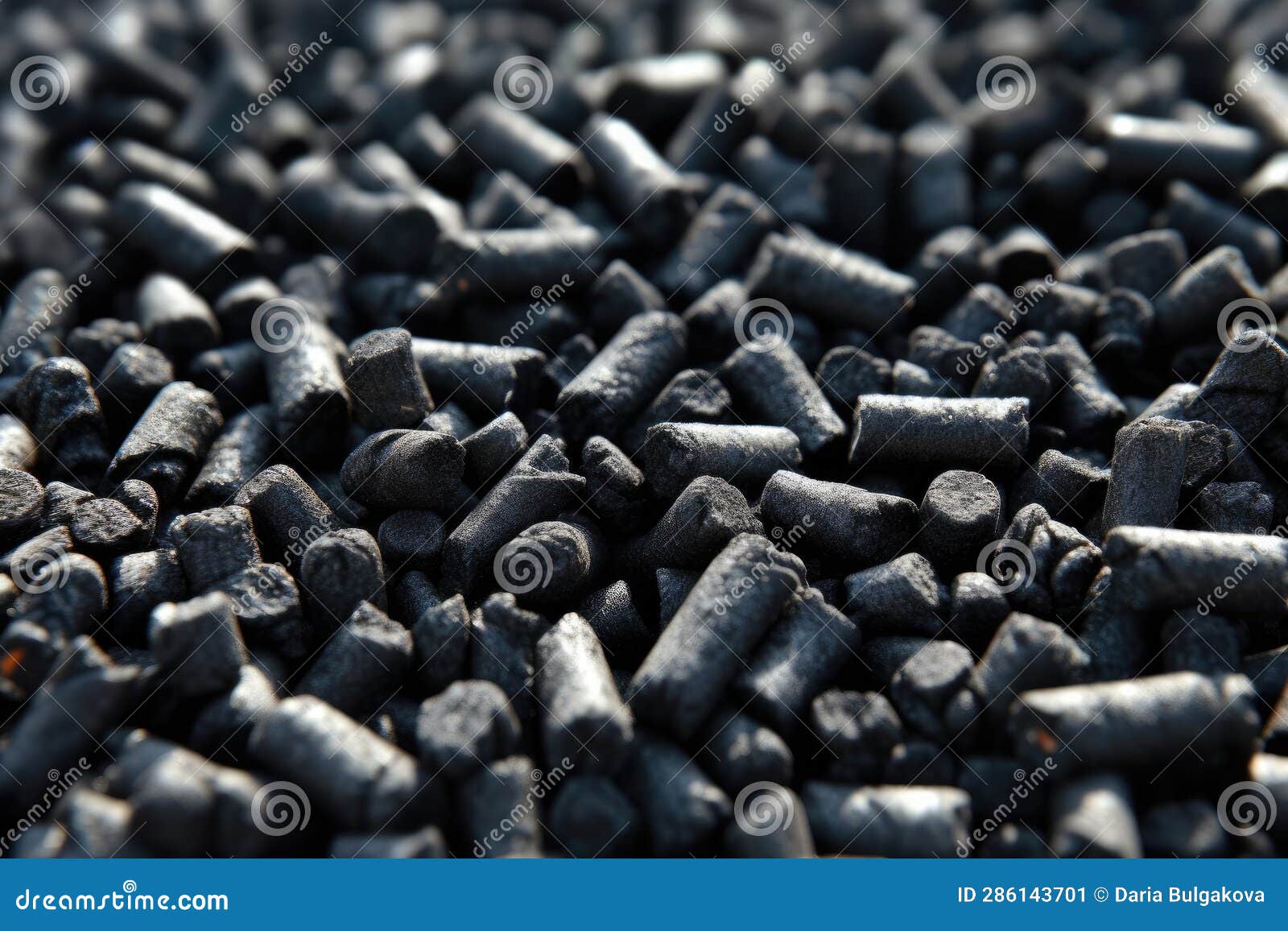 black granules biochar pellets. organic biochar derived made from woody material through pyrolysis. biochar increases the carbon