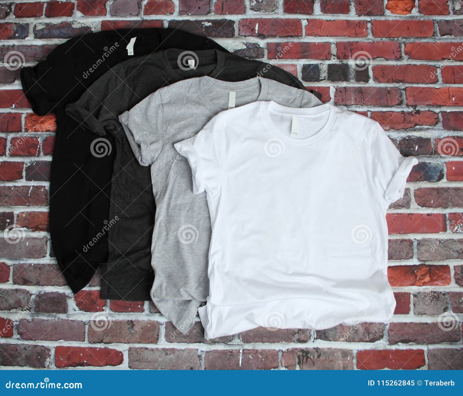 Download Black, Gray, And White T Shirt Mockup On Brick Background ...